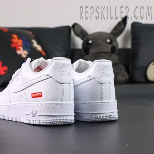 Rear heel view of Supreme x Nike Air Force 1 Low SP ‘Box Logo - White’ with embossed Nike Air and red Supreme logo patch