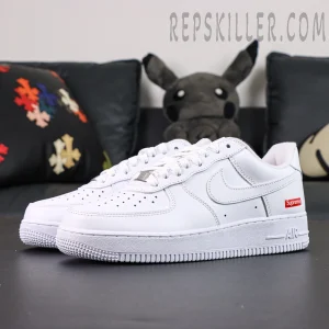 Angled front view of Supreme x Nike Air Force 1 Low SP ‘Box Logo - White’ showcasing signature Supreme branding