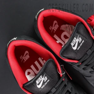 Nike Supreme x Dunk Low SB “Black” insole and tongue detail showing red lining, white Nike SB label, and Supreme branding inside.