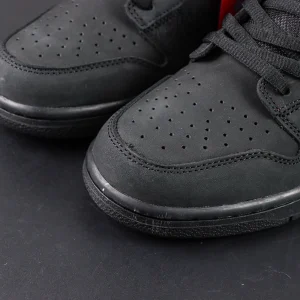 Nike Supreme x Dunk Low SB “Black” close-up of perforated toe box showing fine stitching and suede texture.