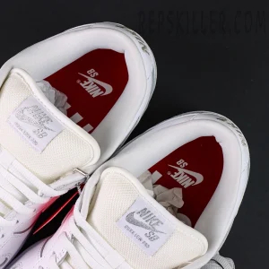 Nike Supreme x Dunk Low SB “White Metallic Silver” close-up of tongue and insole showing Nike SB tag and red branding.