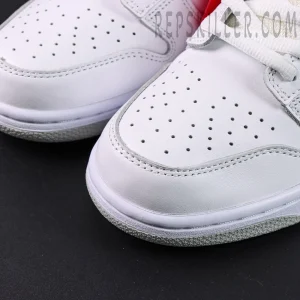 Nike Supreme x Dunk Low SB “White Metallic Silver” detailed shot of toe box showing premium white leather and fine stitching.