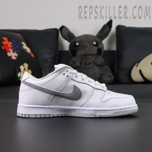 Nike Supreme x Dunk Low SB “White Metallic Silver” side profile showing metallic silver swoosh and Supreme midsole branding.