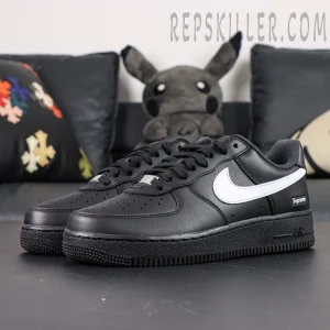 Side front angle of Supreme x Nike Air Force 1 Low SP ‘Box Logo - Black White’ highlighting white swoosh on black leather base
