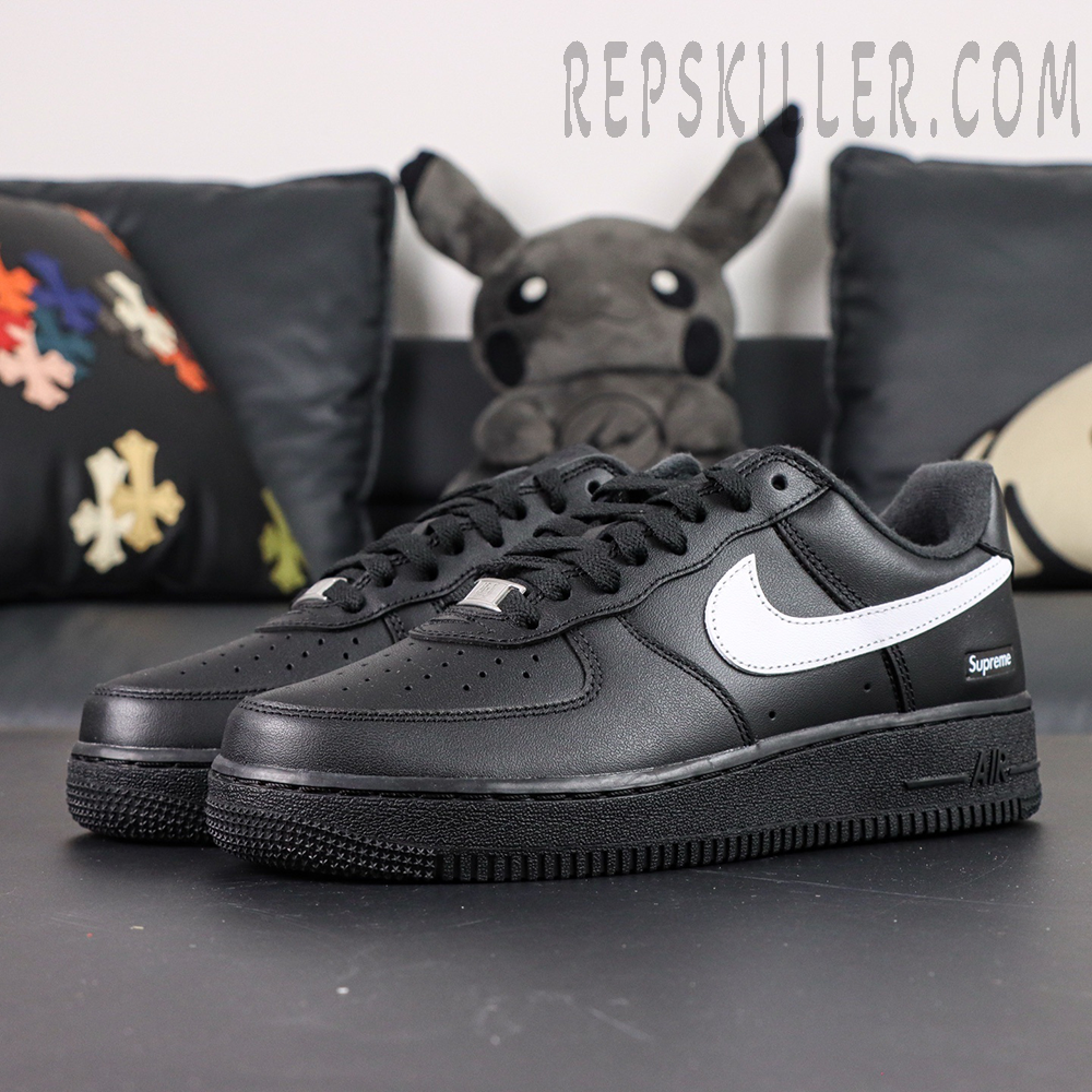 Side front angle of Supreme x Nike Air Force 1 Low SP ‘Box Logo - Black White’ highlighting white swoosh on black leather base