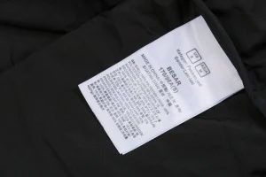 The North Face x KAWS 1996 Retro Nuptse Down Jacket Black Wash label