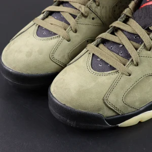 Close-up of Travis Scott x Air Jordan 6 “Olive” toe box showing suede texture and stitching details.