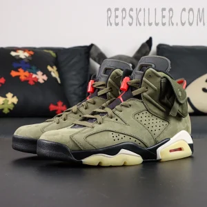 Angled side shot of Travis Scott x Air Jordan 6 “Olive,” emphasizing olive nubuck upper and red accents.