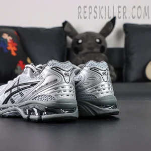Rear angled view of Urban Research x ASICS Gel-Kayano 14 “Pure Silver Black” highlighting dual GEL pods and heel contours.