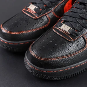 Close-up of Vlone x NikeLab Air Force 1 “Vlone” toe box with orange stitching and metallic lace tag.