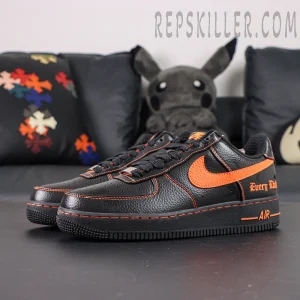 Side view of Vlone x NikeLab Air Force 1 “Vlone” showing black tumbled leather upper with orange Swoosh and stitching.