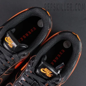 Overhead view of Vlone x NikeLab Air Force 1 “Vlone” showing black insoles with orange Nike Air branding.