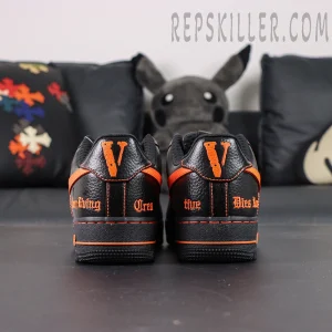 Rear view of Vlone x NikeLab Air Force 1 “Vlone” showing embroidered orange “V” and gothic text on heel.