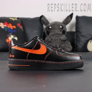 Side profile of Vlone x NikeLab Air Force 1 “Vlone” showing orange Swoosh and black midsole with orange “AIR” text.