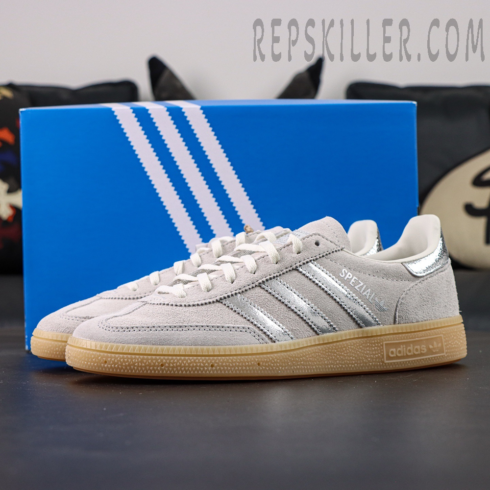 Adidas Handball Spezial Grey Silver Gum side profile featuring grey suede upper and silver stripes with blue adidas box behind