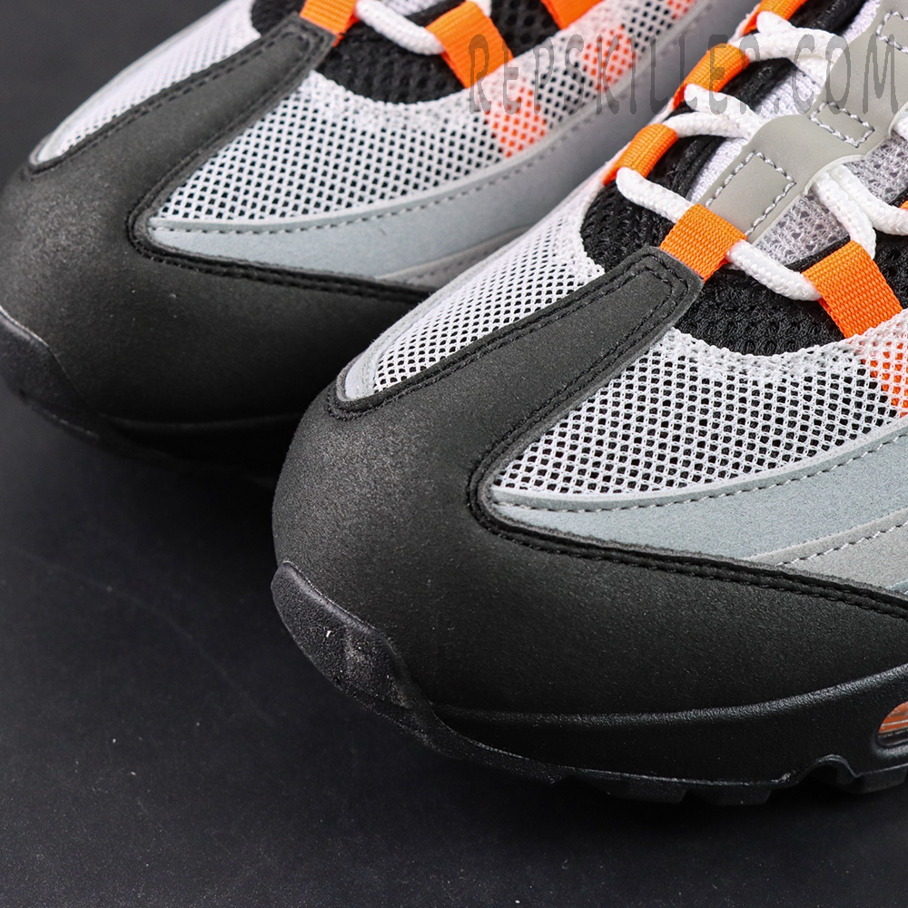 Air Max 95 Bright Mandarin toe box close-up with mesh and suede overlays
