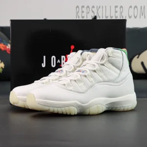 Jordan 11 Retro ‘285’ white leather sneakers with multicolor collar displayed in front of the black Jordan box.