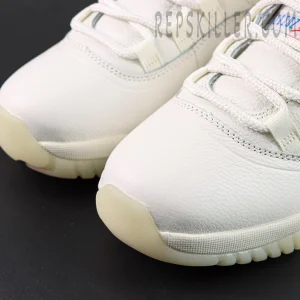 Close-up of the Jordan 11 Retro ‘285’ white leather toebox and mudguard stitching details.