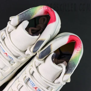Top view of the Jordan 11 Retro ‘285’ showing multicolor padded collar and white leather tongue.