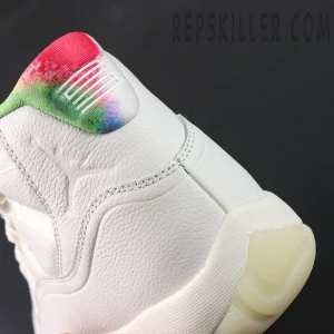 Side heel close-up of the Jordan 11 Retro ‘285’ featuring multicolor ankle collar and embossed Jumpman logo.