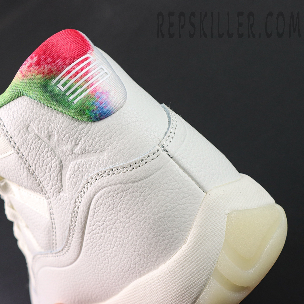 Side heel close-up of the Jordan 11 Retro ‘285’ featuring multicolor ankle collar and embossed Jumpman logo.