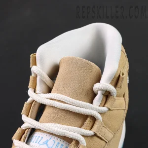 Close-up of the padded collar, suede tongue and white rope laces on the Jordan 11 Retro ‘H-Town’.