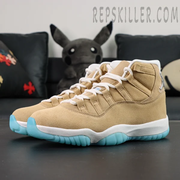 Jordan 11 Retro ‘H-Town’ sneakers in tan suede with icy blue outsole, side-angle display.