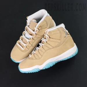 Overhead shot of the Jordan 11 Retro ‘H-Town’ pair featuring tan suede upper and white laces.