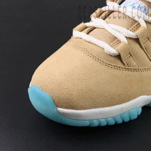 Close-up of the suede toe box with icy blue bumper on the Jordan 11 Retro ‘H-Town’.