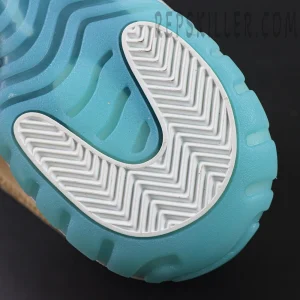 Close-up of the icy blue outsole with white herringbone traction on the Jordan 11 Retro ‘H-Town’.