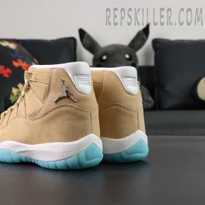 Rear three-quarter view of both shoes showing the suede upper, metallic Jumpman and icy outsole on the Jordan 11 Retro ‘H-Town’.