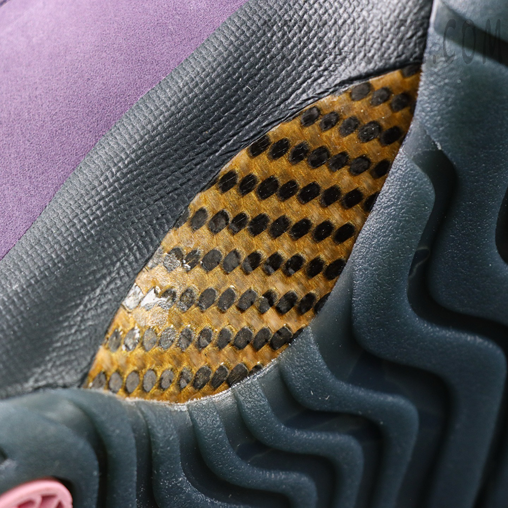 Close-up of Air Jordan 11 ‘Mojave’ carbon fiber shank plate on outsole