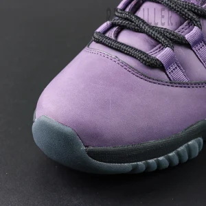 Close-up of Air Jordan 11 ‘Mojave’ toe box in purple nubuck material