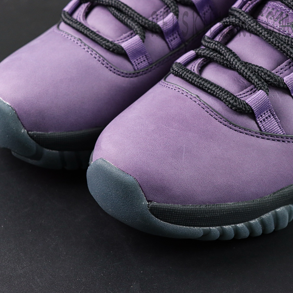 Toe box close-up showing the smooth purple suede material on the Jordan 11 Retro ‘Mojave’.