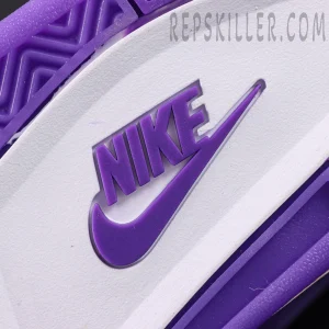 Close-up of the Nike logo on the outsole of the Nigel Sylvester x Jordan 4 ‘Brick By Brick’ Purple in white and purple rubber.