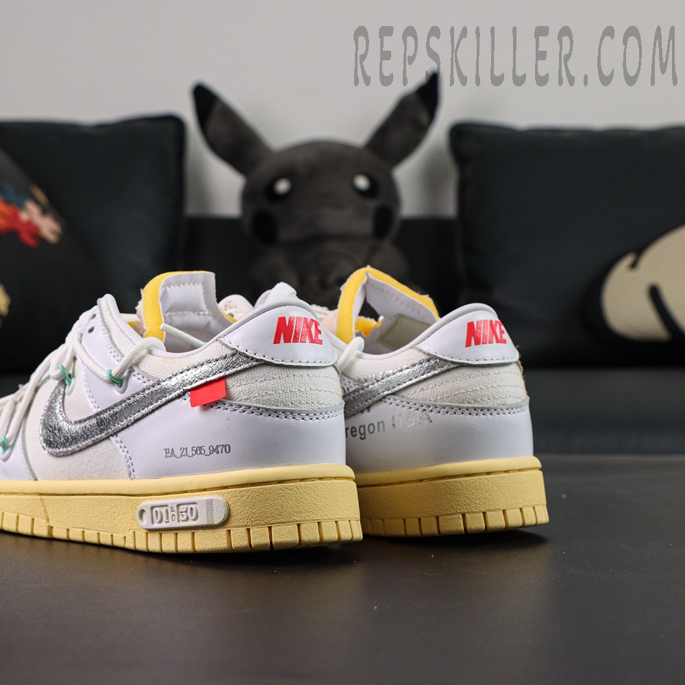Off-White x Nike Dunk Low Lot 01 of 50 rear angle showing red Nike heel logo and silver Swoosh