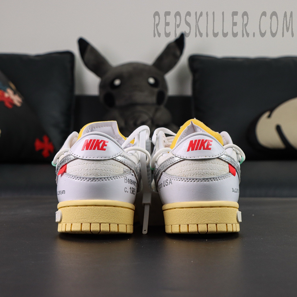 Off-White x Nike Dunk Low Lot 01 of 50 heel view highlighting exposed foam tongue and stitched details