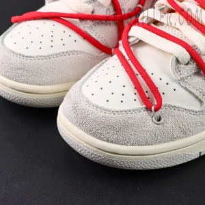 Close-up of Off-White x Nike Dunk Low Lot 40 of 50 toe box with grey suede and red overlay lace system