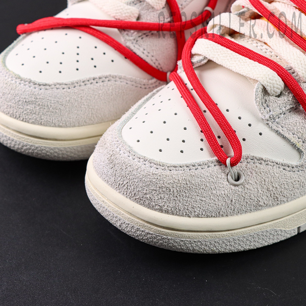 Close-up of Off-White x Nike Dunk Low Lot 40 of 50 toe box with grey suede and red overlay lace system