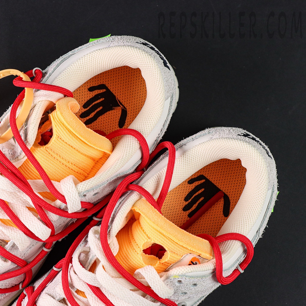Insole detail of Off-White x Nike Dunk Low Lot 40 of 50 highlighting hand graphic print and orange exposed foam tongue