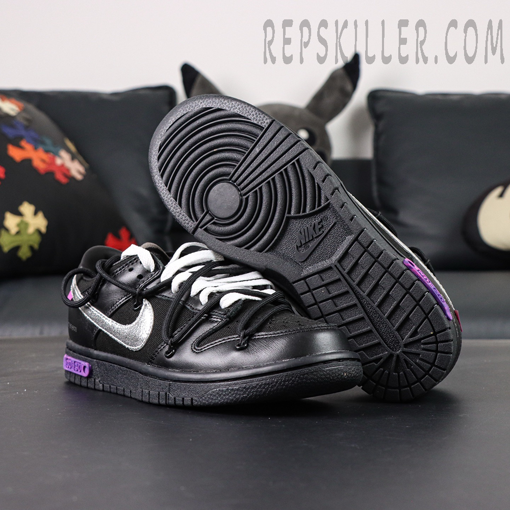 Bottom view of Off-White x Nike Dunk Low Lot 50 of 50 featuring black outsole and purple lot badge.