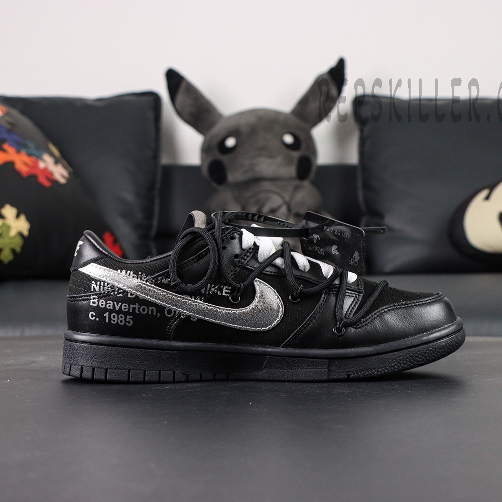 Side profile of Off-White x Nike Dunk Low Lot 50 of 50 with metallic Swoosh and Off-White text print.