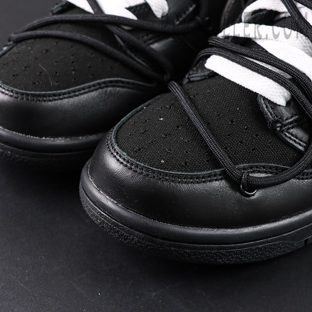 Close-up of Off-White x Nike Dunk Low Lot 50 of 50 black toe box with double-lace system.
