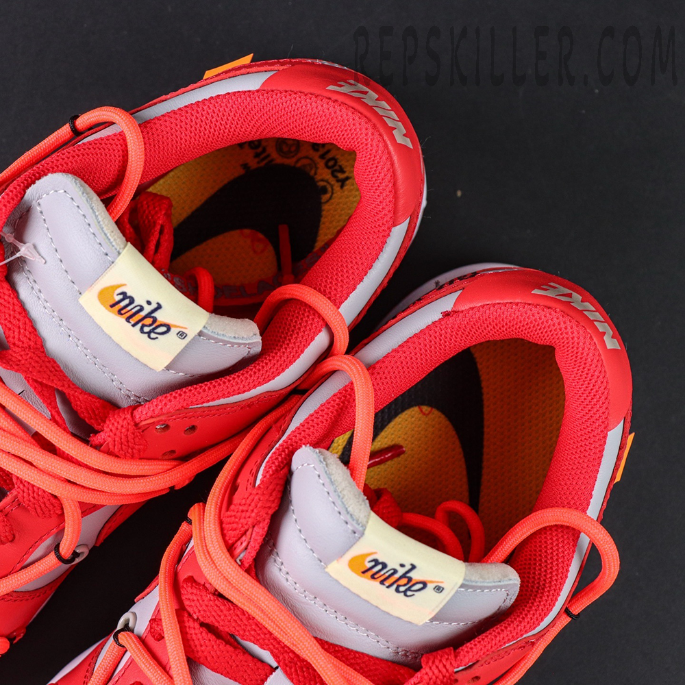 Close-up of the toe box on the Off-White x Dunk Low “University Red,” revealing premium leather, perforation details, and contrasting lace overlay.