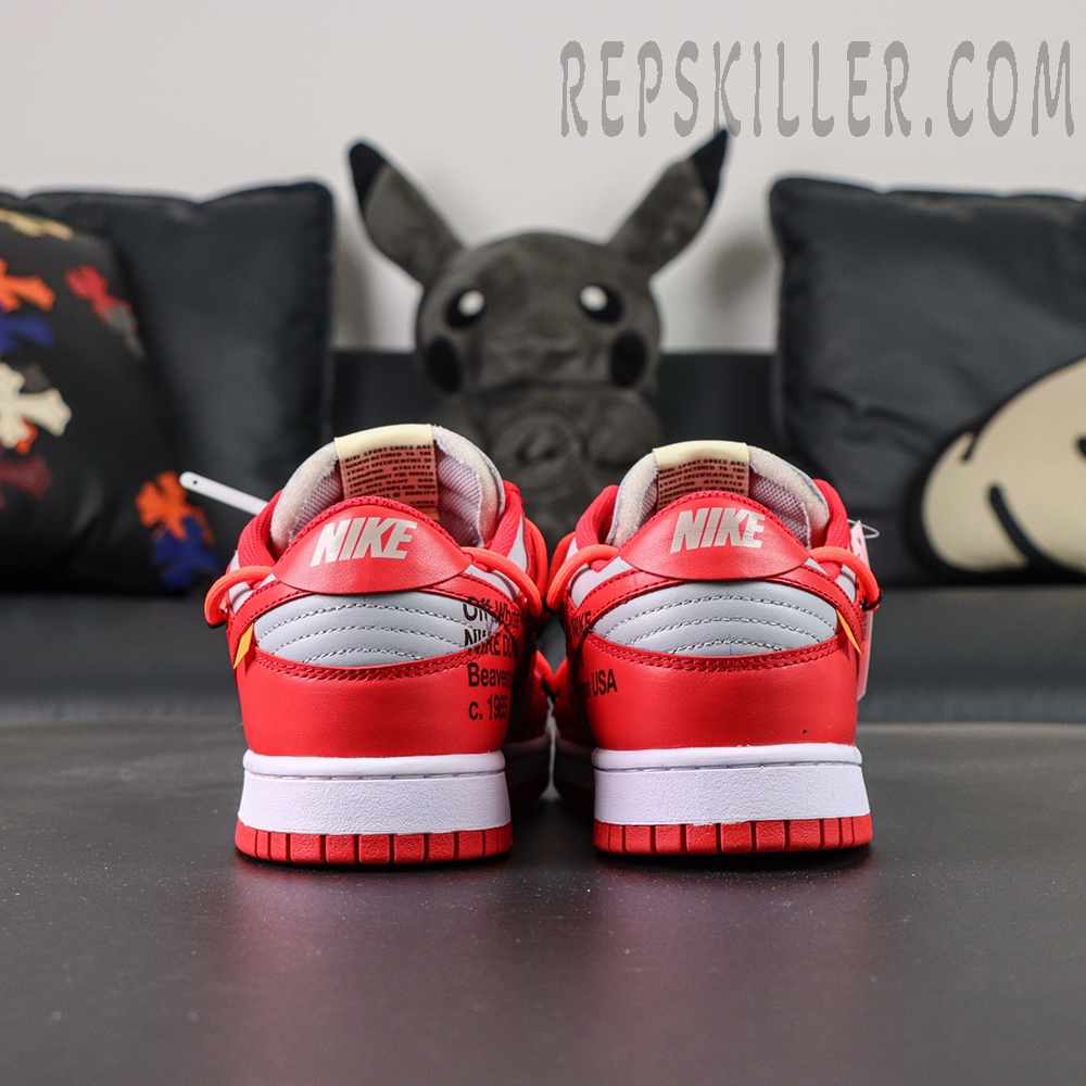 Angled pair shot of the Off-White Dunk Low “University Red” emphasizing layered textures, industrial-inspired details, and streetwear aesthetic.