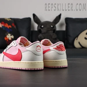Angled rear view of the Travis Scott x Air Jordan 1 Low OG “Tropical Pink” showing cream midsoles and pink outsoles.