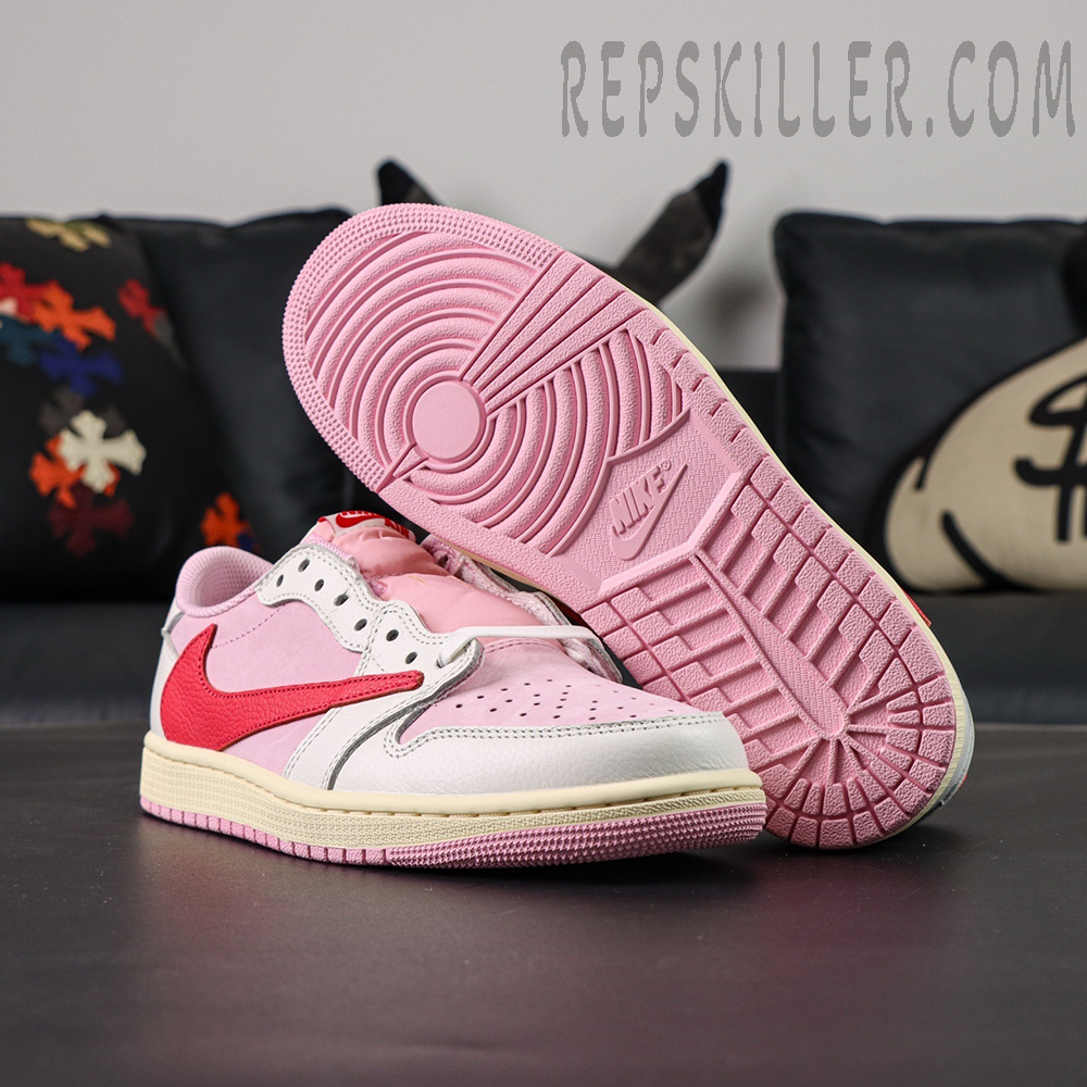 Outsole view of the Travis Scott x Air Jordan 1 Low OG “Tropical Pink” featuring a pink rubber sole with Nike branding.