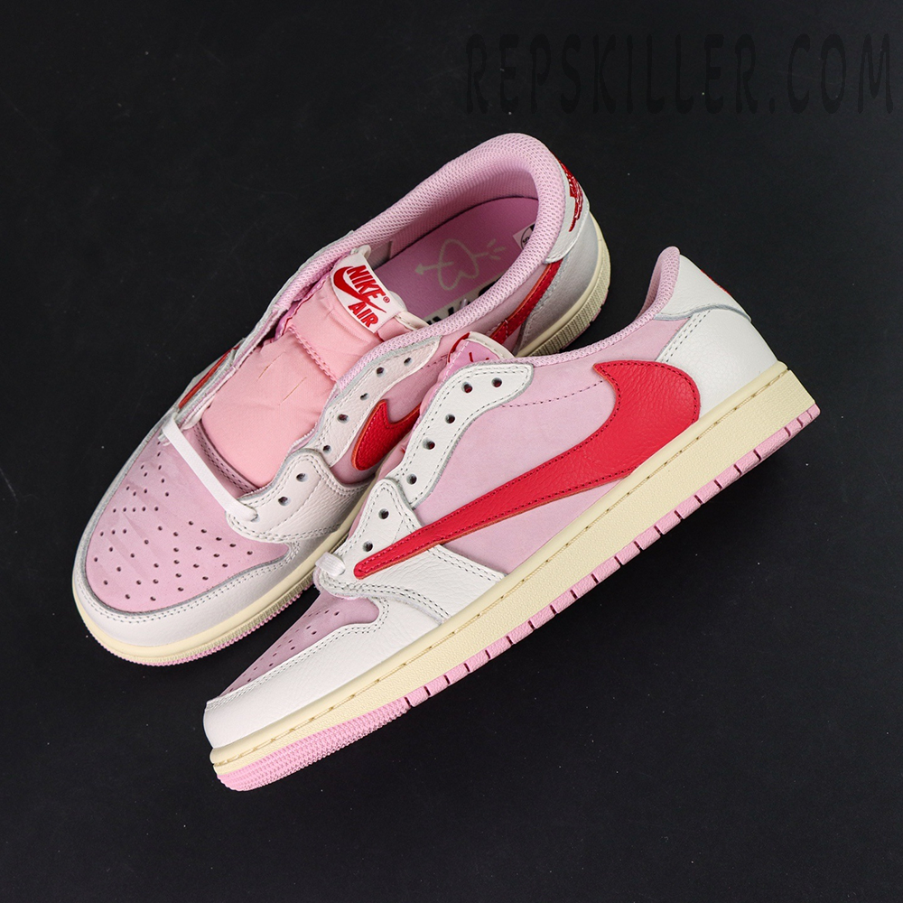 Top-down view of the Travis Scott x Air Jordan 1 Low OG “Tropical Pink” highlighting the reversed red Swoosh and pink leather overlays.