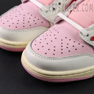 Close-up of the toe box on the Travis Scott x Air Jordan 1 Low OG “Tropical Pink,” showing pink nubuck and perforation details.
