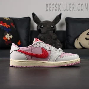 Side view of the Travis Scott x Air Jordan 1 Low OG “Tropical Pink” with the signature reversed red Swoosh and pink nubuck upper.